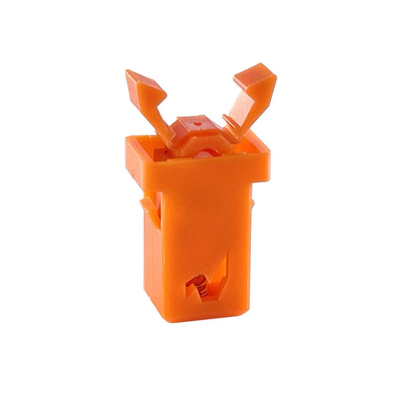 Interruttore a pulsante arancione con chiusura a scatto della scatola degli stuzzicadenti